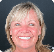Smiling woman with blonde hair and blue eyes at the Ultimate Blogging Championship.