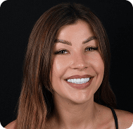 Smiling woman with long brown hair and bright teeth at Ultimate Blogging Championship.